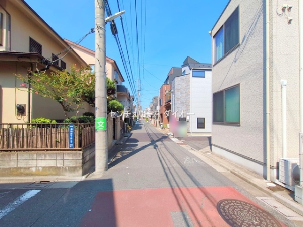 葛飾区金町4丁目1号棟の前面道路含む現地写真画像